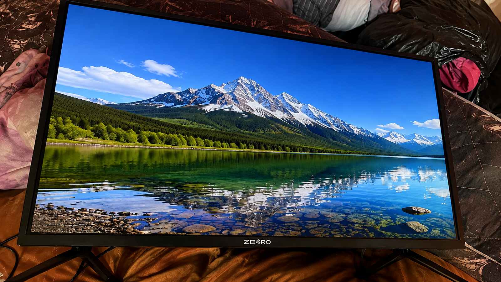 TV screen before backlight repair, showing a dark display