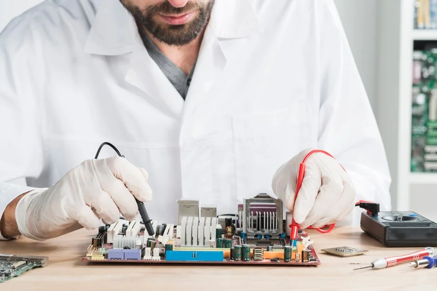 Certified Prime Electronics Repair technician diagnosing a TV fault